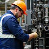 Technician performing machinery maintenance